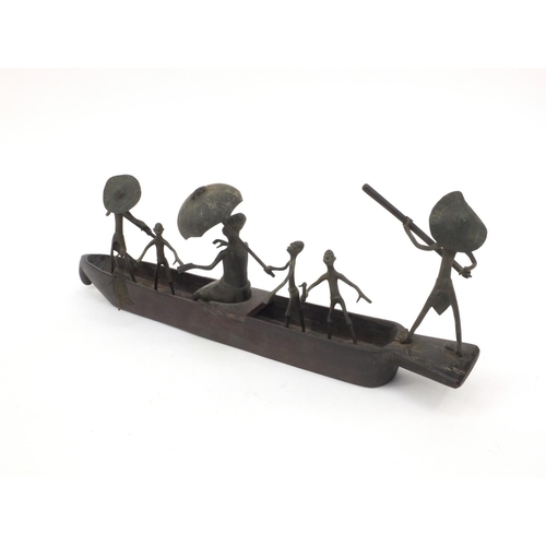 2305 - Middle Eastern Benin style wooden and bronze boat with figures, 47cm long