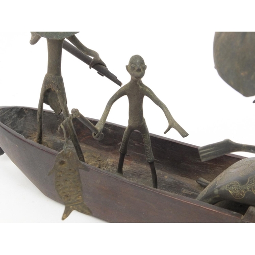 2305 - Middle Eastern Benin style wooden and bronze boat with figures, 47cm long