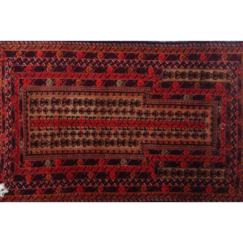 2054 - Two rectangular Middle Eastern Afghan rugs, both with geometric designs, both with labels to the und... 