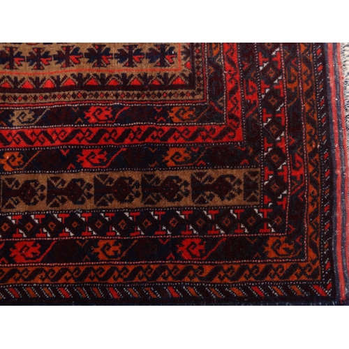 2054 - Two rectangular Middle Eastern Afghan rugs, both with geometric designs, both with labels to the und... 