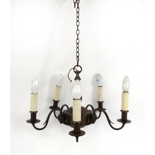 2066 - Bronzed metal five branch chandelier with rams heads, 35cm high