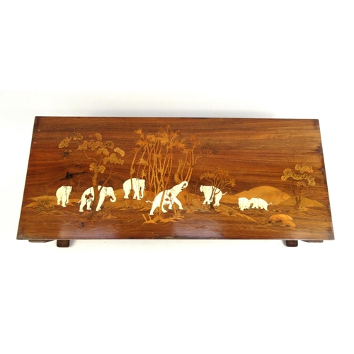 2030 - Hardwood coffee table inlaid with ivory decorated with elephants around an oasis with palm trees, 41... 