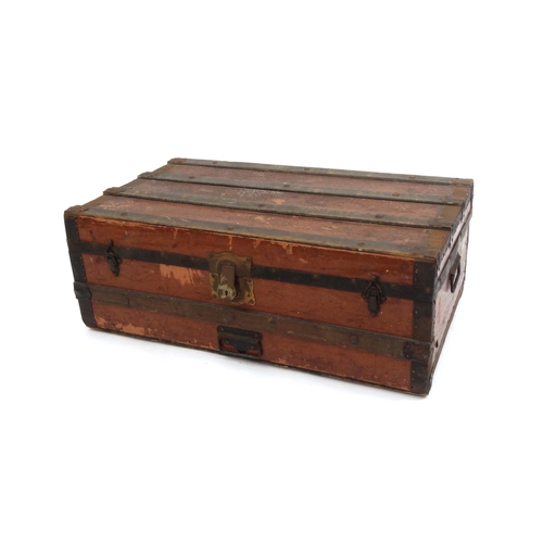 2063 - Vintage metal bound wooden travelling trunk, 31cm high x 83cm wide x 48cm deep