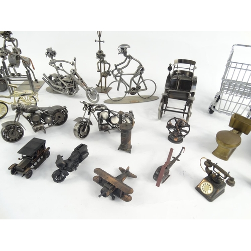 2311 - Collection of nut and bolt figures, novelty pencil sharpeners etc