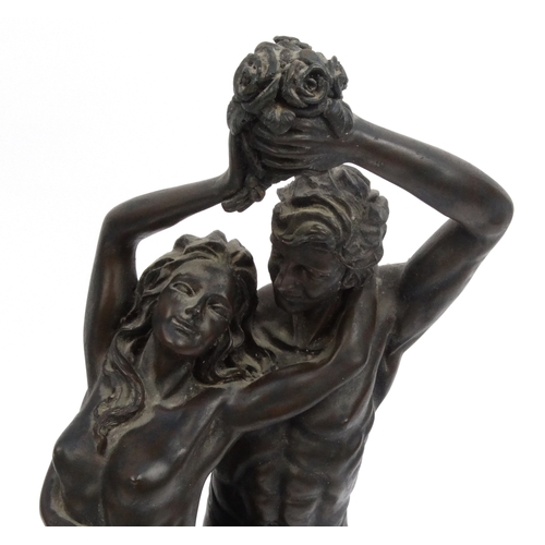 2158 - Two large decorative bronze style nude figures, the larger 61cm high