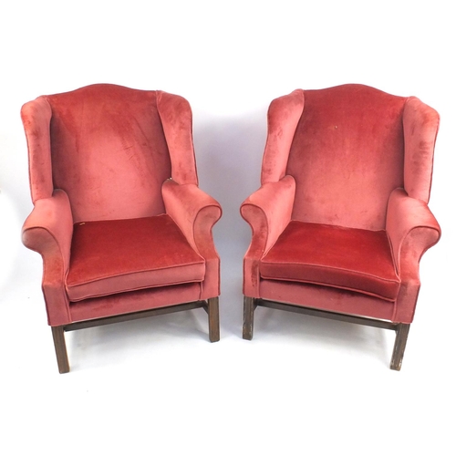 11 - Pair of mahogany framed wingback arm chairs, with pink upholstery