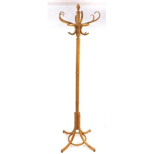 27 - Light wood coat stand, approximately 185cm high