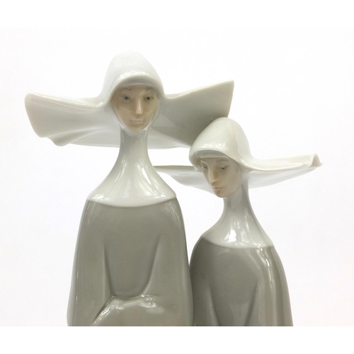 2099 - Lladro model of two nuns, factory marks to the base, 33cm high