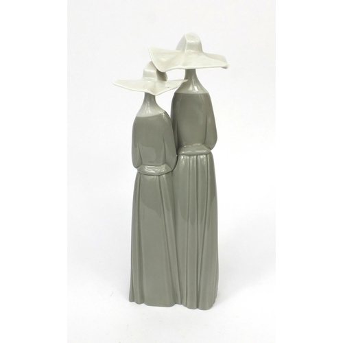 2099 - Lladro model of two nuns, factory marks to the base, 33cm high