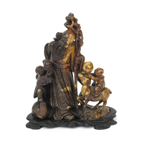 823 - Finely carved Chinese soapstone figure group of an elder holding a staff, with two children holding ... 