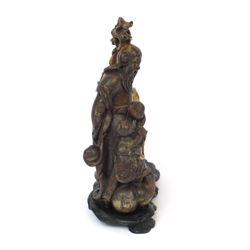 823 - Finely carved Chinese soapstone figure group of an elder holding a staff, with two children holding ... 