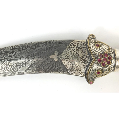 534 - Indian Mughal dagger with watered blade, the handle modelled as a mythical creature set with semi pr... 