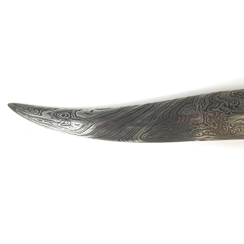 534 - Indian Mughal dagger with watered blade, the handle modelled as a mythical creature set with semi pr... 