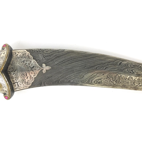 534 - Indian Mughal dagger with watered blade, the handle modelled as a mythical creature set with semi pr... 