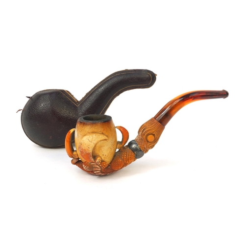 331 - Meerschaum pipe carved in the form of a claw, with silver coloured metal collar and amber coloured m... 
