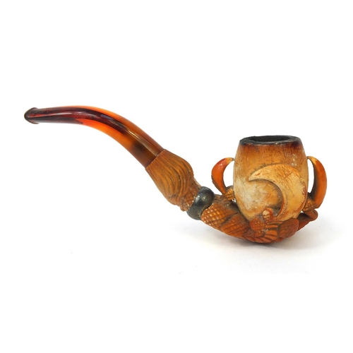 331 - Meerschaum pipe carved in the form of a claw, with silver coloured metal collar and amber coloured m... 