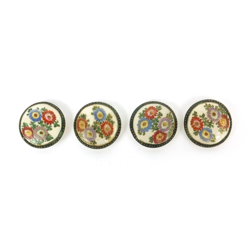 784 - Four Japanese Satsuma pottery buttons hand painted with Chrysanthemums, each 2.5cm in diameter