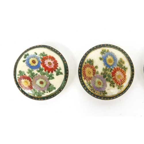 784 - Four Japanese Satsuma pottery buttons hand painted with Chrysanthemums, each 2.5cm in diameter