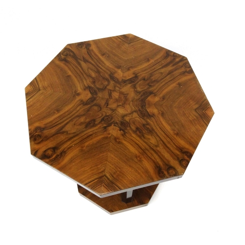 2021 - Art Deco octagonal occasional table raised on ebonised columns, 67cm high x 59cm diameter
