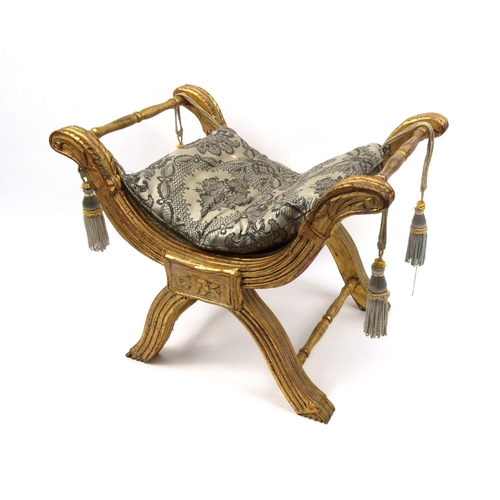 2027 - Gilt wood x-frame stool with cushion seat, 57cm high