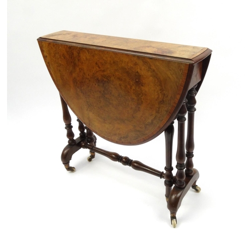 2001 - Victorian burr walnut Sutherland table, the oval cross banded top raised on baluster shaped supports... 