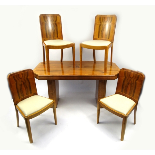 2006 - Art Deco walnut twin pedestal dining table and four chairs with cream leatherette upholstered seats,... 