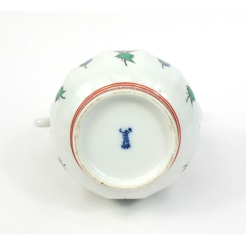 2074 - Japanese porcelain teapot hand painted with flowers, character marks to the base, 23cm high