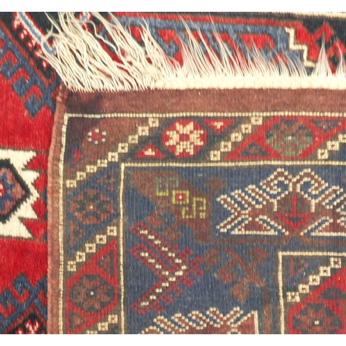 2013 - Rectangular Middle Eastern rug with geometric border and central field, 200cm x 127cm