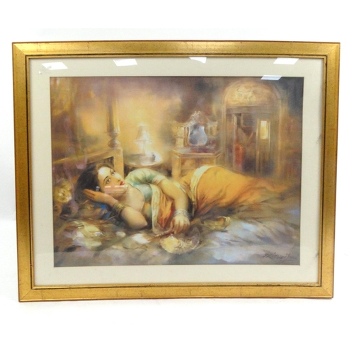 18 - Gilt framed print of a Middle Eastern lady resting on a bed, 91cm x 79cm excluding the frame