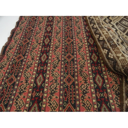 56 - Two antique geometric patterned rugs and a hand woven throw