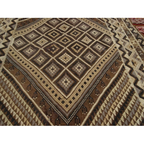 56 - Two antique geometric patterned rugs and a hand woven throw
