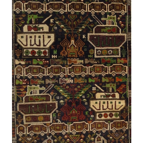 2025 - Rectangular Middle Eastern rug, the border and central field decorated with tanks, 205cm x 115cm