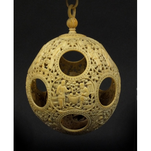 789 - Chinese Cantonese ivory layered puzzle ball on chain, the outer layer profusely carved with figures ... 