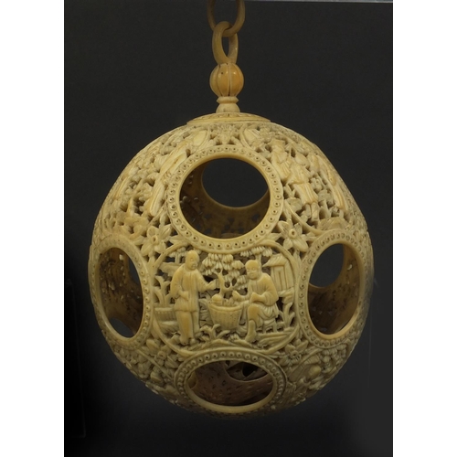 789 - Chinese Cantonese ivory layered puzzle ball on chain, the outer layer profusely carved with figures ... 