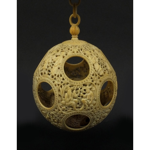 789 - Chinese Cantonese ivory layered puzzle ball on chain, the outer layer profusely carved with figures ... 