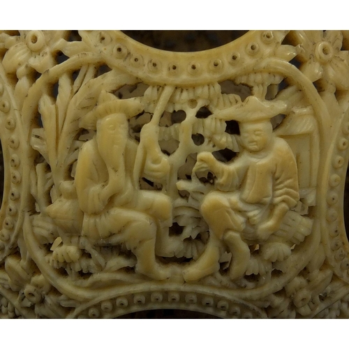 789 - Chinese Cantonese ivory layered puzzle ball on chain, the outer layer profusely carved with figures ... 