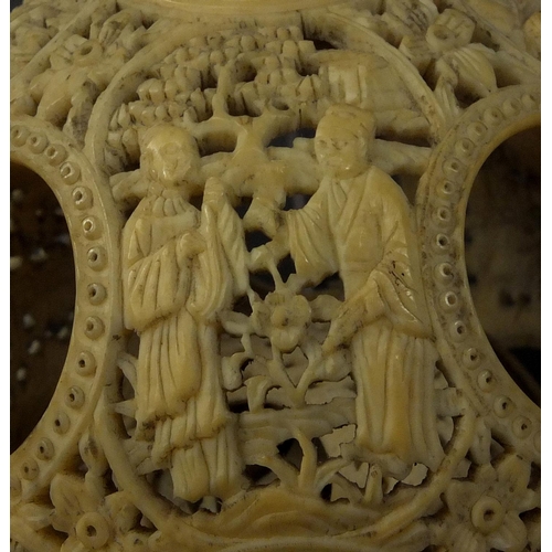 789 - Chinese Cantonese ivory layered puzzle ball on chain, the outer layer profusely carved with figures ... 