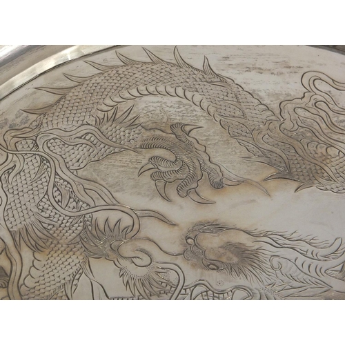 796 - Chinese silver salver by Wang Hing engraved with dragons, the pierced border decorated with dragons ... 