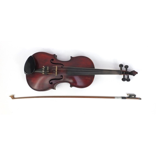 545 - Old wooden violin with one piece back, bearing a label to the interior, together with a bow and fitt... 