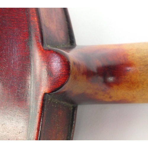 545 - Old wooden violin with one piece back, bearing a label to the interior, together with a bow and fitt... 