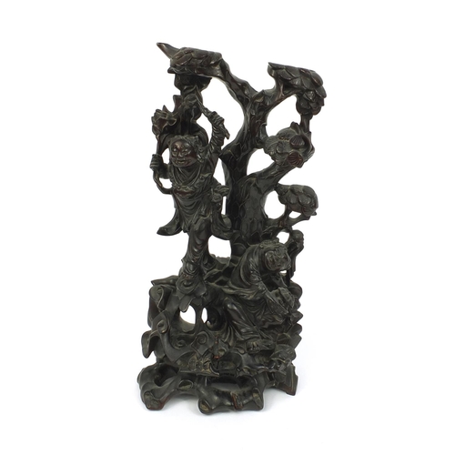 815 - Chinese hardwood root carving of two figures standing upon a tree, paper label to the base, 43cm hig... 