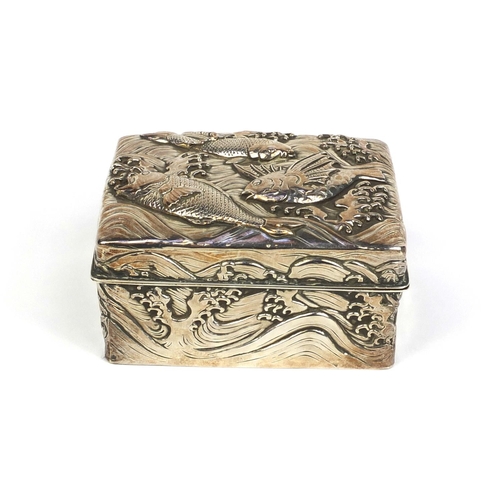 802 - Rectangular Japanese double skin silver box the hinged lid and body profusely embossed with three fi... 