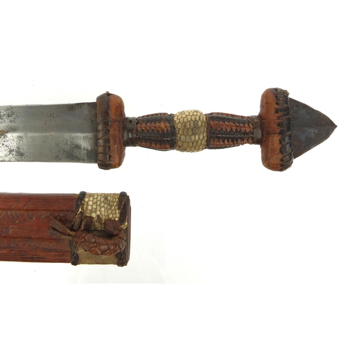 537 - Middle Eastern dagger with snake skin and leather sheath and grip, 28cm long