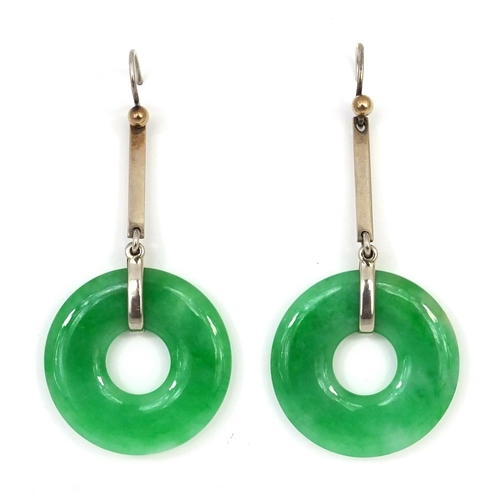 803 - Pair of Chinese green jade hoop earrings with white metal mounts, each 2.8cm in diameter excluding t... 