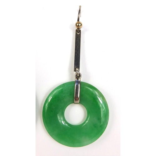 803 - Pair of Chinese green jade hoop earrings with white metal mounts, each 2.8cm in diameter excluding t... 