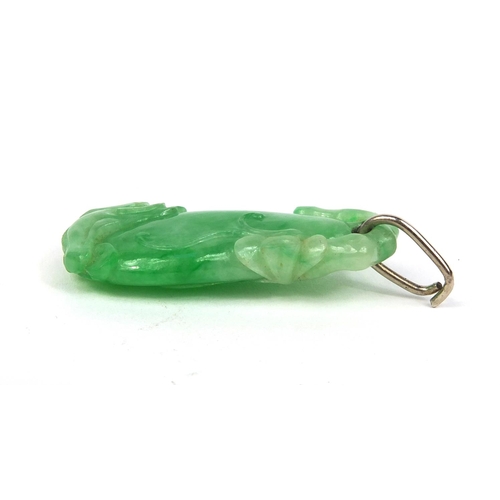 804 - Chinese green jade pendant carved with a dragon, 4cm high, approximate weight 8.1g