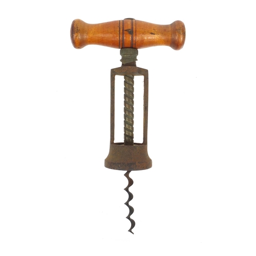 35 - Cast iron wooden handled corkscrew, 18cm when closed
