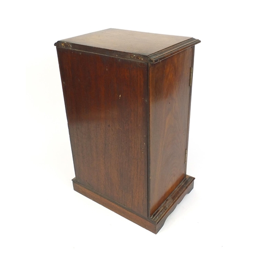 335 - Edwardian oak smokers cabinet, the bevelled glass door opening to reveal a fitted interior, 43cm x 2... 