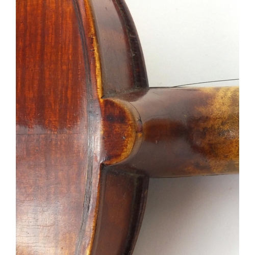 543 - Old wooden violin with two piece back, bearing a Richard Peat label together with fitted case, the v... 