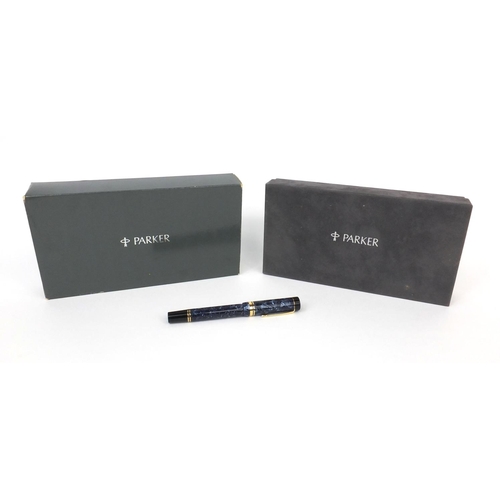 302 - Boxed Parker Sentennial blue marbleised fountain pen with 18k gold nib and accessories, the fountain... 